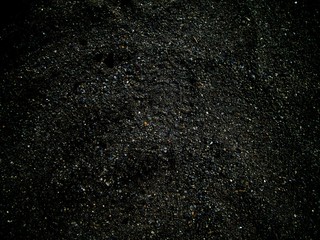 Dark abstract photo with lightly visible footprint