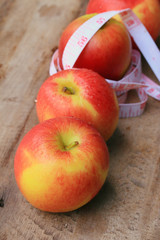 measure tape and apple