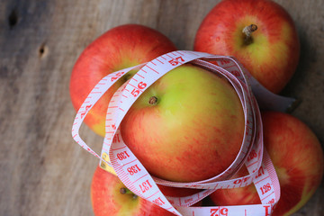 measure tape and apple