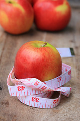 measure tape and apple