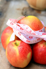 measure tape and apple