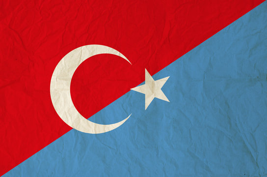 Flag of Turkey and Uyghurs with vintage old paper