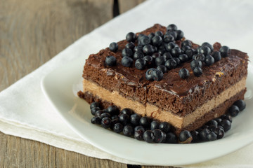 Chocolate cake with blueberry on plate