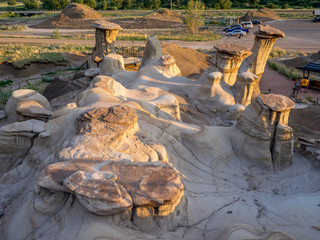 Hoodoos bathed in the warm light of a summer sunset at Drumheller Alberta Canada.
