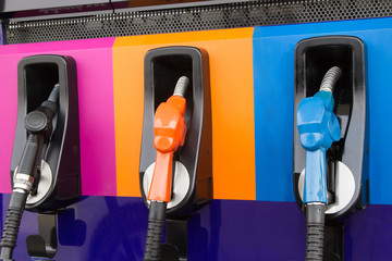 Gasoline Pump nozzles at the gas station.