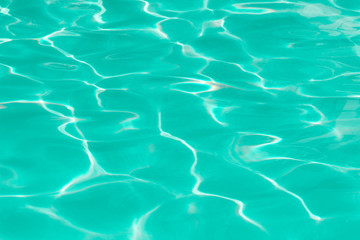 green pool water with sun reflections