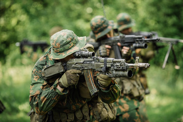 Group of soldiers special forces during the raid in the forest