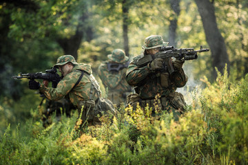Group of soldiers special forces during the raid in the forest