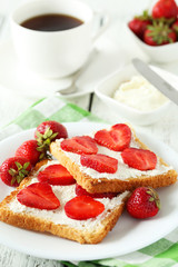 Fresh toast with strawberry on white wooden background