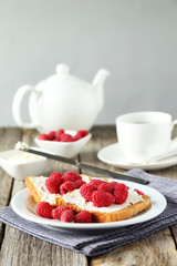 Fresh toast with raspberry on grey wooden background