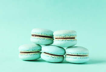 French macarons on blue background