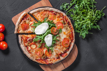 Vegetarian pizza with mozzarella and arugula.