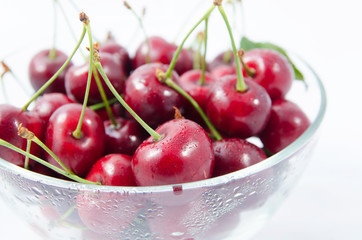 Heap of sweet cherries in a glass bowl