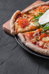 Vegetarian pizza with mozzarella and arugula.