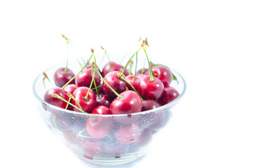 Heap of sweet cherries in a glass bowl