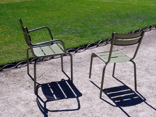 couple of chair in a park