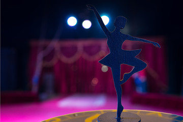 Ballerina Silhouette Statue Spotlit on Empty Stage