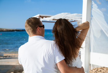 Happy young couple looking on the sea © zest_marina