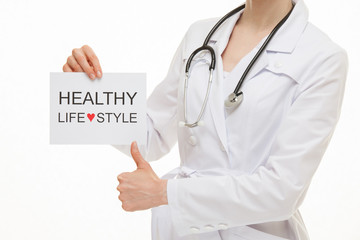 Doctor calling to healthy lifestyle and showing thumb up sign