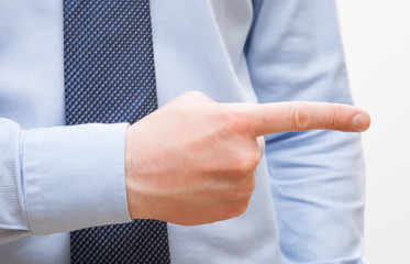 Businessman's hand indicating something