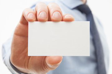 Unrecognizable businessman showing business card