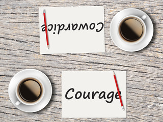 Business Concept : Comparison between courage and cowardice