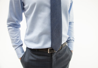 Unrecognizable businessman hiding his hands in pockets - obrazy, fototapety, plakaty