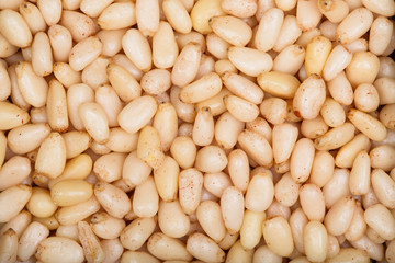 Background texture of shelled pine nuts.