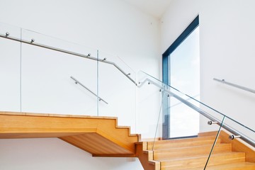 Modern architecture interior with wooden stairs