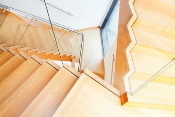 Modern architecture interior with wooden stairs