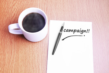 Coffee, pen and notes write campaign