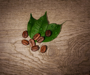 Coffee beans on wooden background