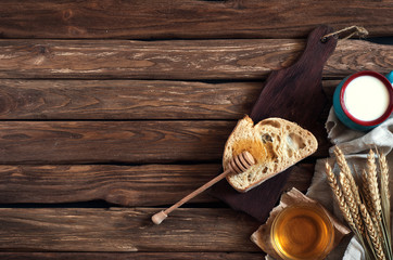 Breakfast. A slice of bread, honey, milk and wheat ears