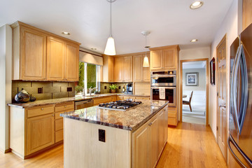 State of the art kitchen with hardwood fl oor and glossy counter