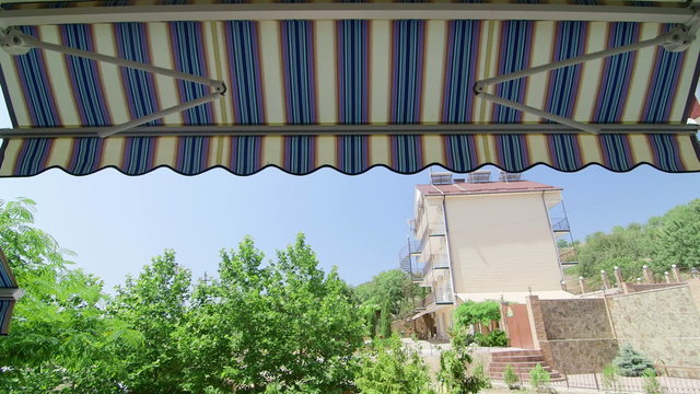 Folding retractable awning opening process