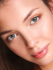 Fototapeta premium Close up portrait of beautiful young woman face. Isolated on