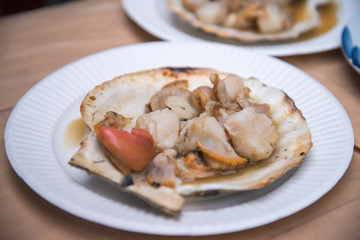 Grilled scallops topped with butter
