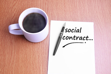 Coffee, pen and notes write social contract