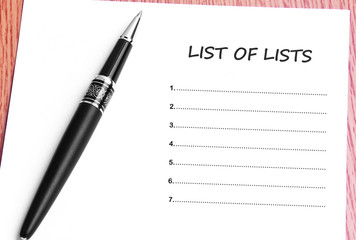 Pen  and notes paper with list of lists