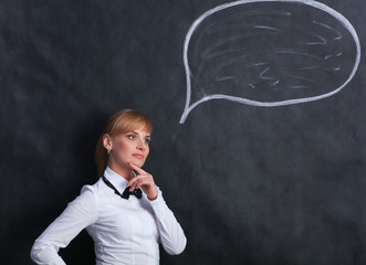 Smiling thinking girl looking with empty bubble 