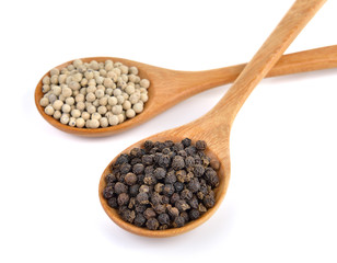 peppercorn in the wooden spoon on white background