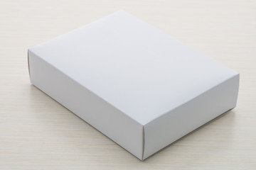 Naklejka premium Paper box on wood background