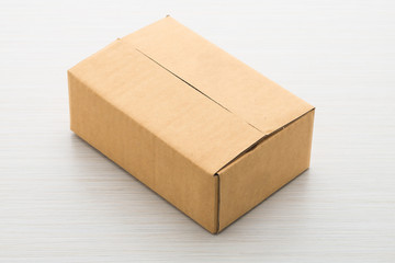 Paper box on wood background