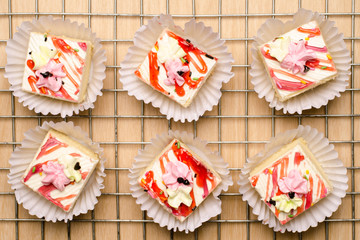 Homemade vanilla cream cake arranged on the rack, delicious dessert