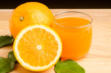 Fresh Navel orange fruit and juice on wooden background,healthy food