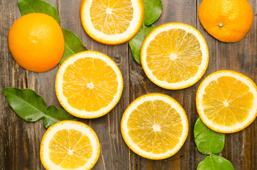 Fototapeta na wymiar Slices of fresh Navel orange fruit on wooden background,healthy food