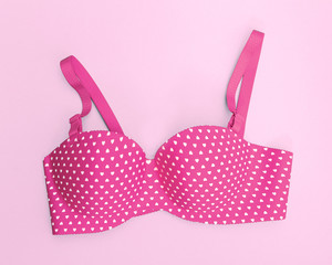 pink bra with many heart shapes on pink background