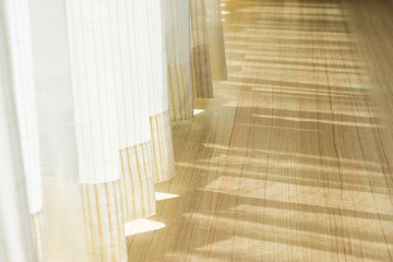 Obraz premium Shadow from shining through a door and the curtains