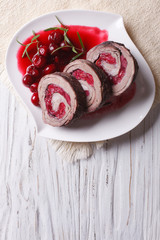 Meat loaf stuffed with cherries close-up vertical top view
