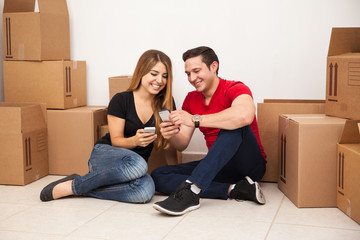 Couple using their smartphones